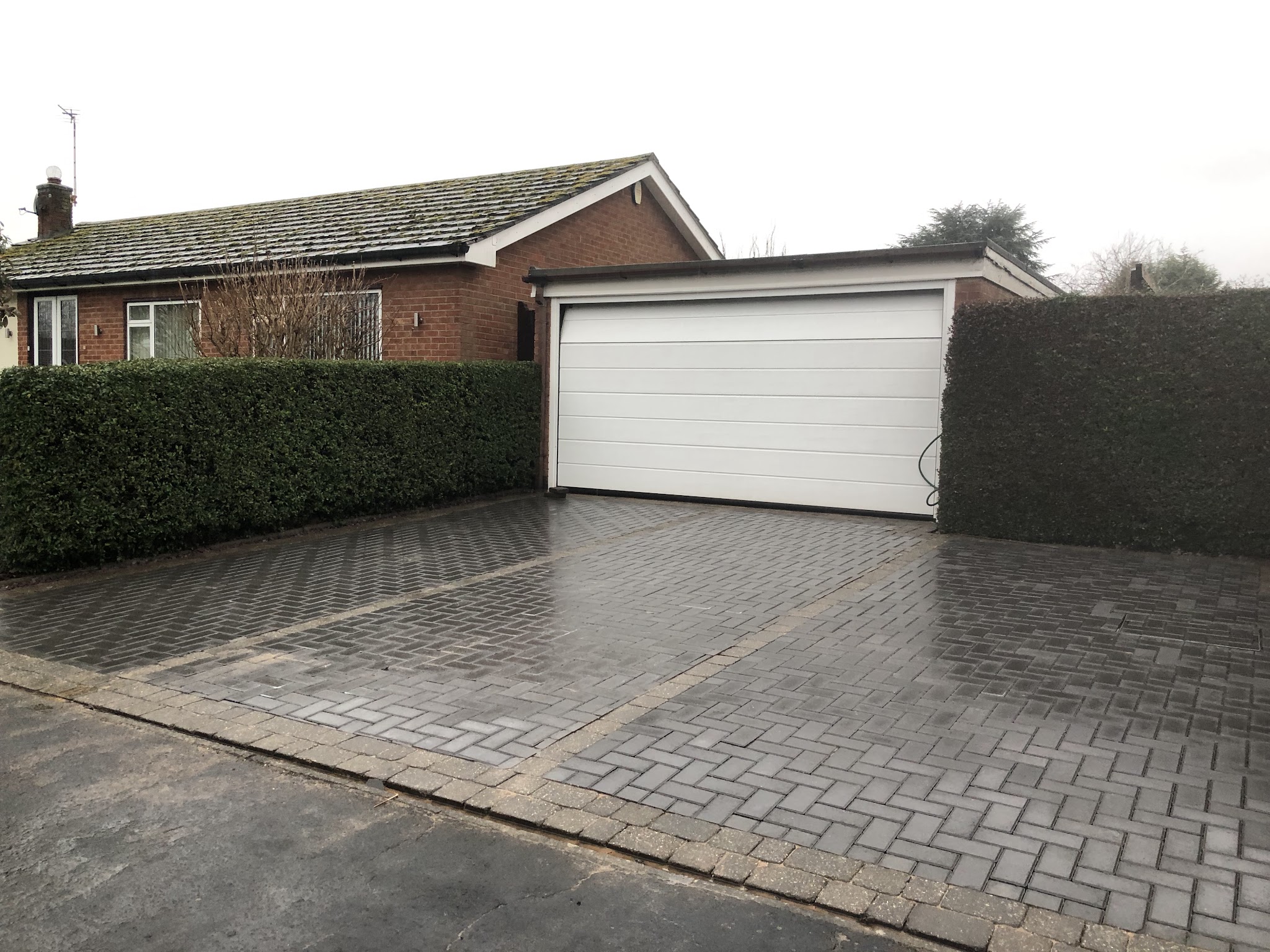 Block-paved driveway in front of a bungalow