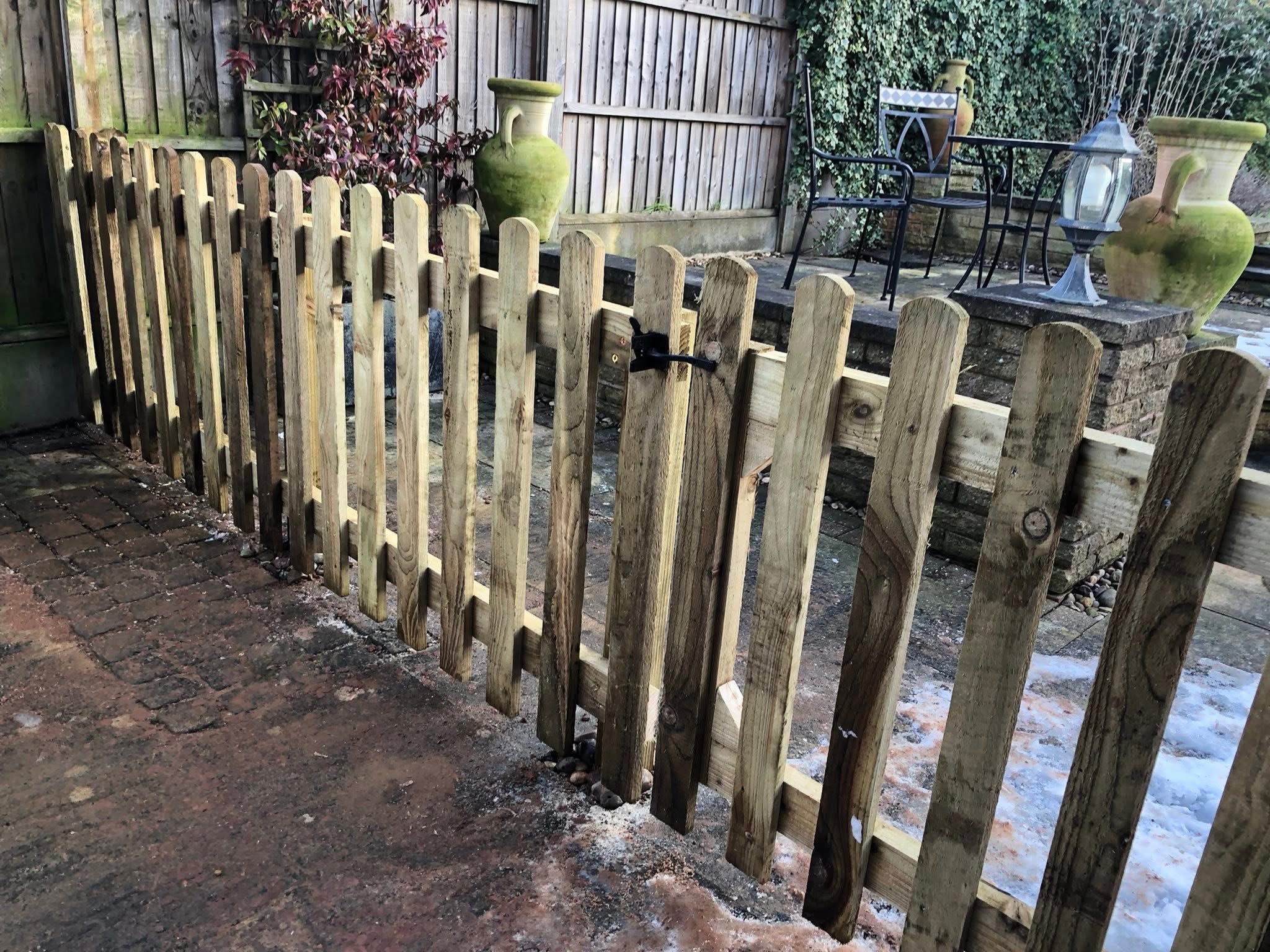 Timber picket fence with a matching gate